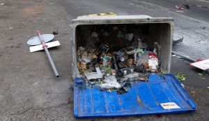 Wheely bin lying on its side - trash image